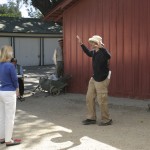 Director, Nat Christian demonstrating a scene on the set of "FOR HEAVEN'S SAKE"