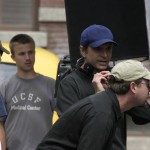 Director, Nat Christian (in blue Cap) - Lining up a shot on the set of "FOR HEAVEN'S SAKE"